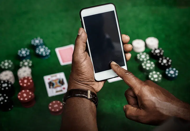 how to start an online casino - black  smartphone`s screen